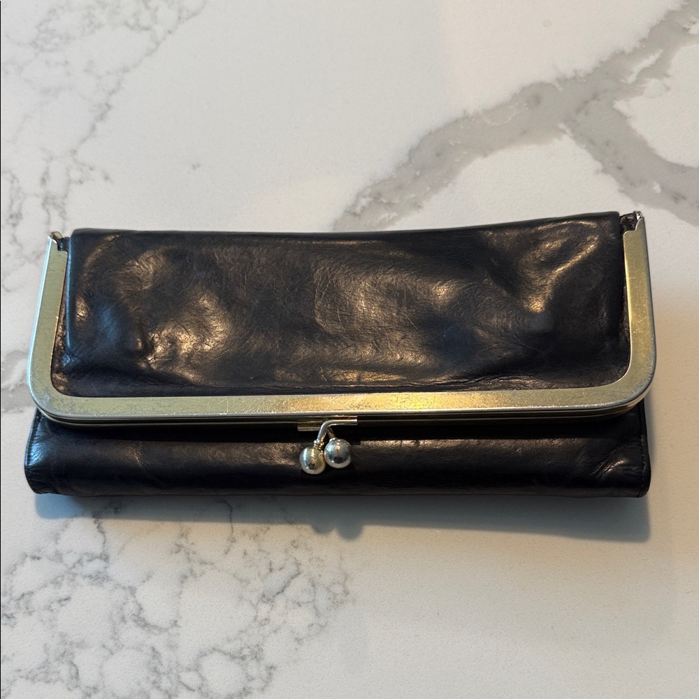 HOBO Elegant Black Leather trifold wallet with pink floral lining